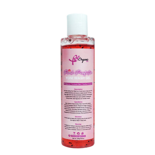 A bottle of Purrfection Peach Yoni Wash with a pink label, 7.0 OZ size.